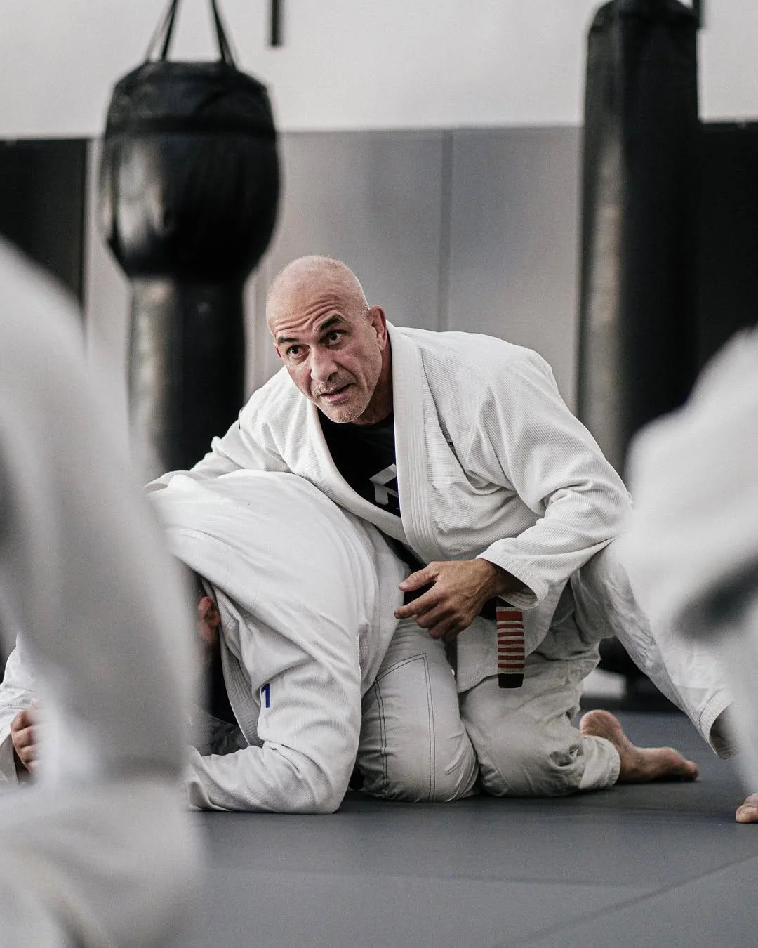 Master Mario Sperry teaching Brazilian jiu-jitsu on the mats at his Miami academy
